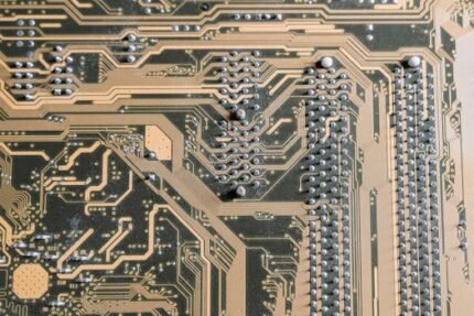Detailed view of intricate circuitry on a computer motherboard.